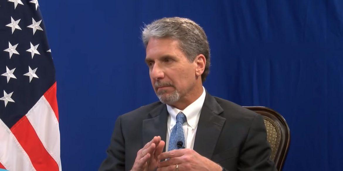 A person in a suit and tie

Description automatically generated with low confidence