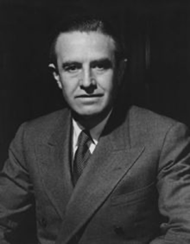 A person in a suit

Description automatically generated with medium confidence