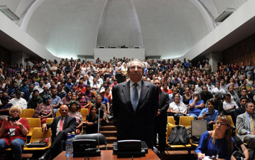 A person standing in front of a large crowd of people
Description automatically generated with medium confidence