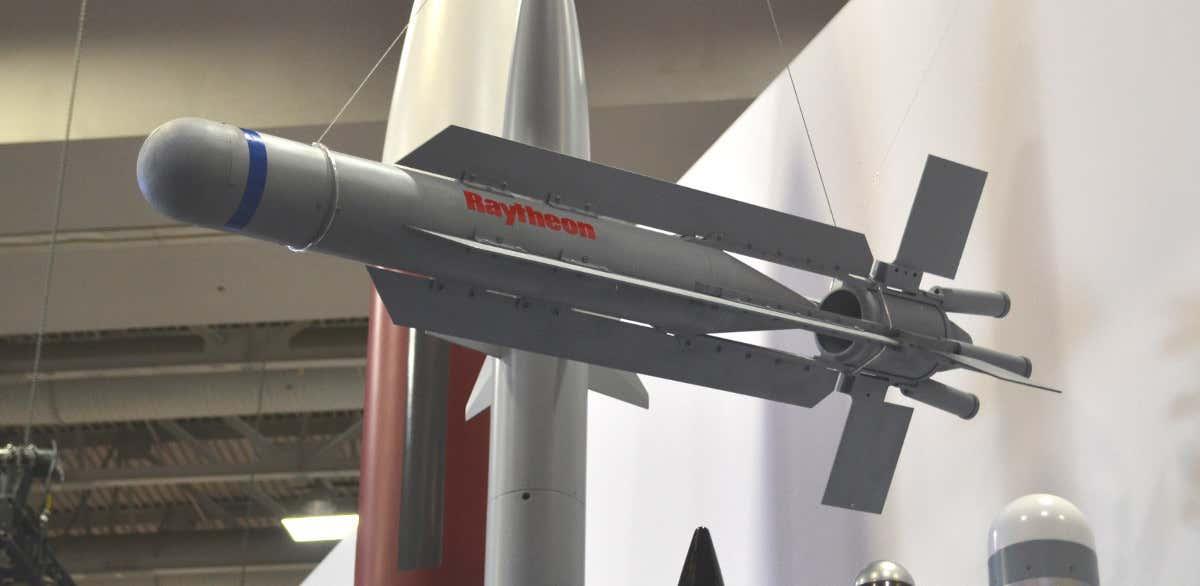 A picture containing indoor, missile, fighter

Description automatically generated