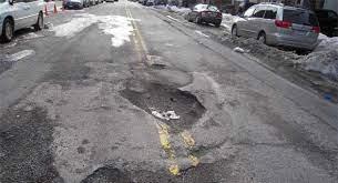 A picture containing text, outdoor, road, ground
Description automatically generated