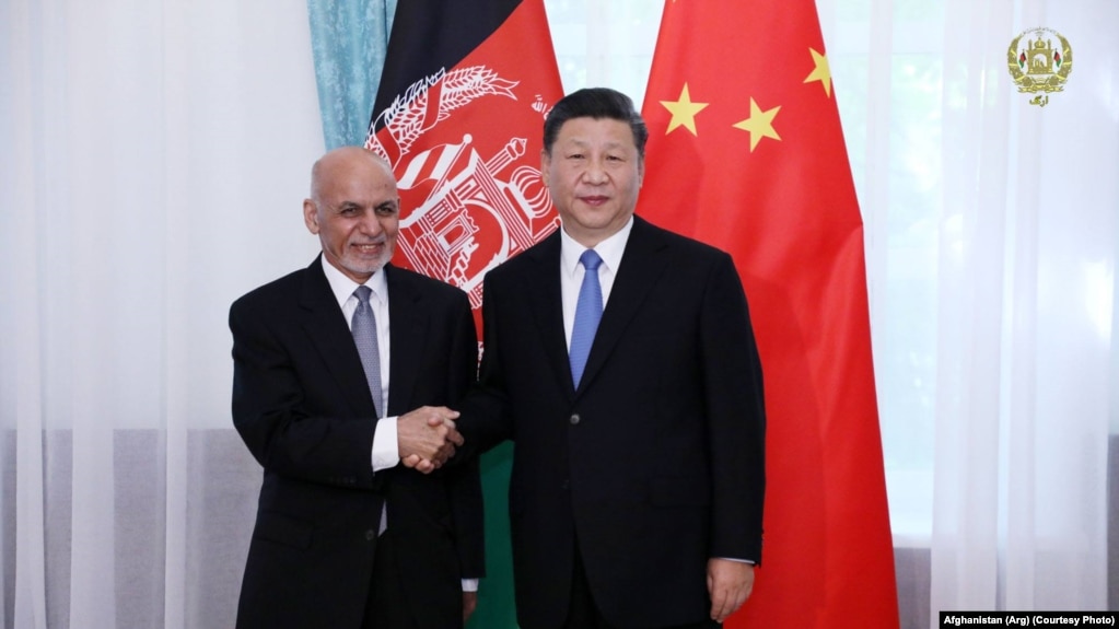 FILE: Afghan President Ashraf Ghani with his Chinese counterpart Xi Jinping in Kyrgyzstan in June 2019.