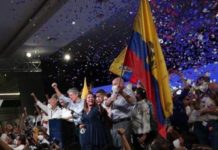 Millionaire Banker and Former Coca Cola Director With Ties to Far-Right Wing Opus Dei Catholic Sect Defeats Socialist Candidate in Ecuador Guillermo Lasso in front of the podium (C) in Guayaquil, Ecuador, April 11, 2021.