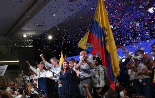 Millionaire Banker and Former Coca Cola Director With Ties to Far-Right Wing Opus Dei Catholic Sect Defeats Socialist Candidate in Ecuador Guillermo Lasso in front of the podium (C) in Guayaquil, Ecuador, April 11, 2021.