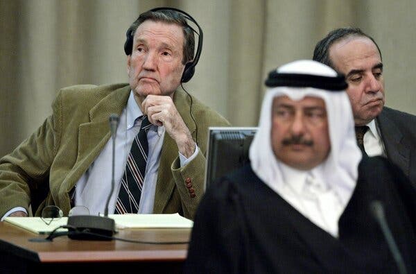 Mr. Clark at the trial of Saddam Hussein in Baghdad in 2005, with Mr. Hussein’s legal advisers Najeeb al-Nauimi, center, and Issam al-Ghazzawi.