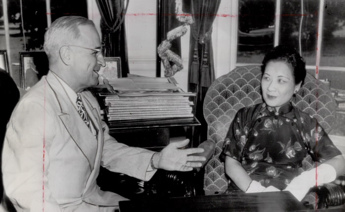 Smiles of victory and friendship are flashed here by President Truman and Mme, Chiang Kai-Shek as they meet at the White House during a visit to Washington of the wife of China's Generalissimo Chiang. They're enjoying news from the Far East