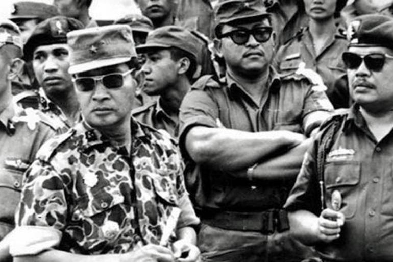 Suharto, on the left in sunglasses, ushered in three decades of military dictatorship [AP]