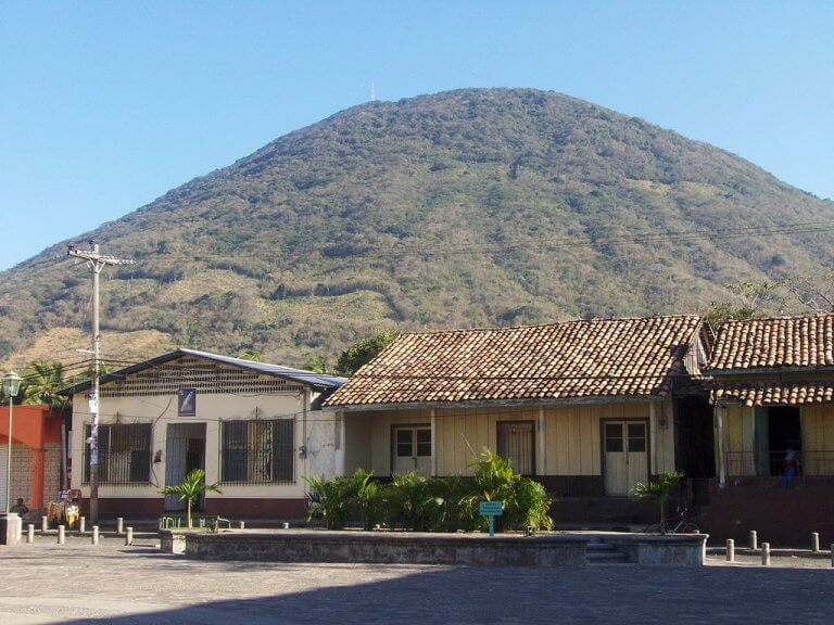 A building with a mountain in the background

Description automatically generated with medium confidence