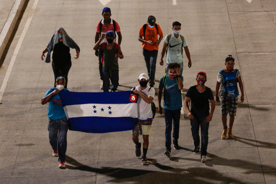A group of people holding a flag

Description automatically generated with medium confidence