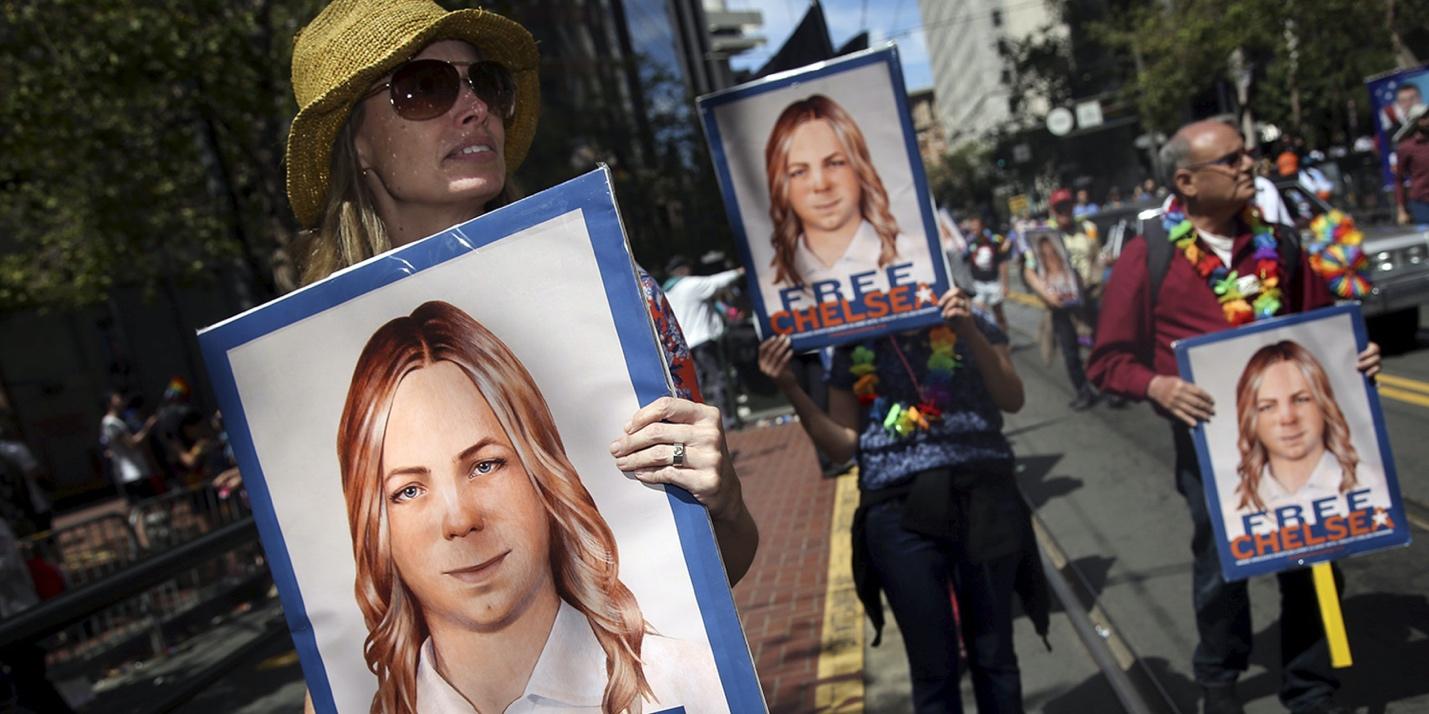 A group of people holding posters
Description automatically generated with low confidence