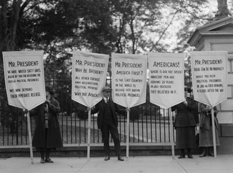 A group of people holding signs

Description automatically generated with medium confidence