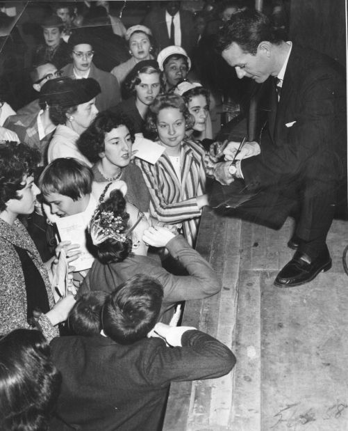 Dr. Thomas A. Dooley signs autographs in St. Louis