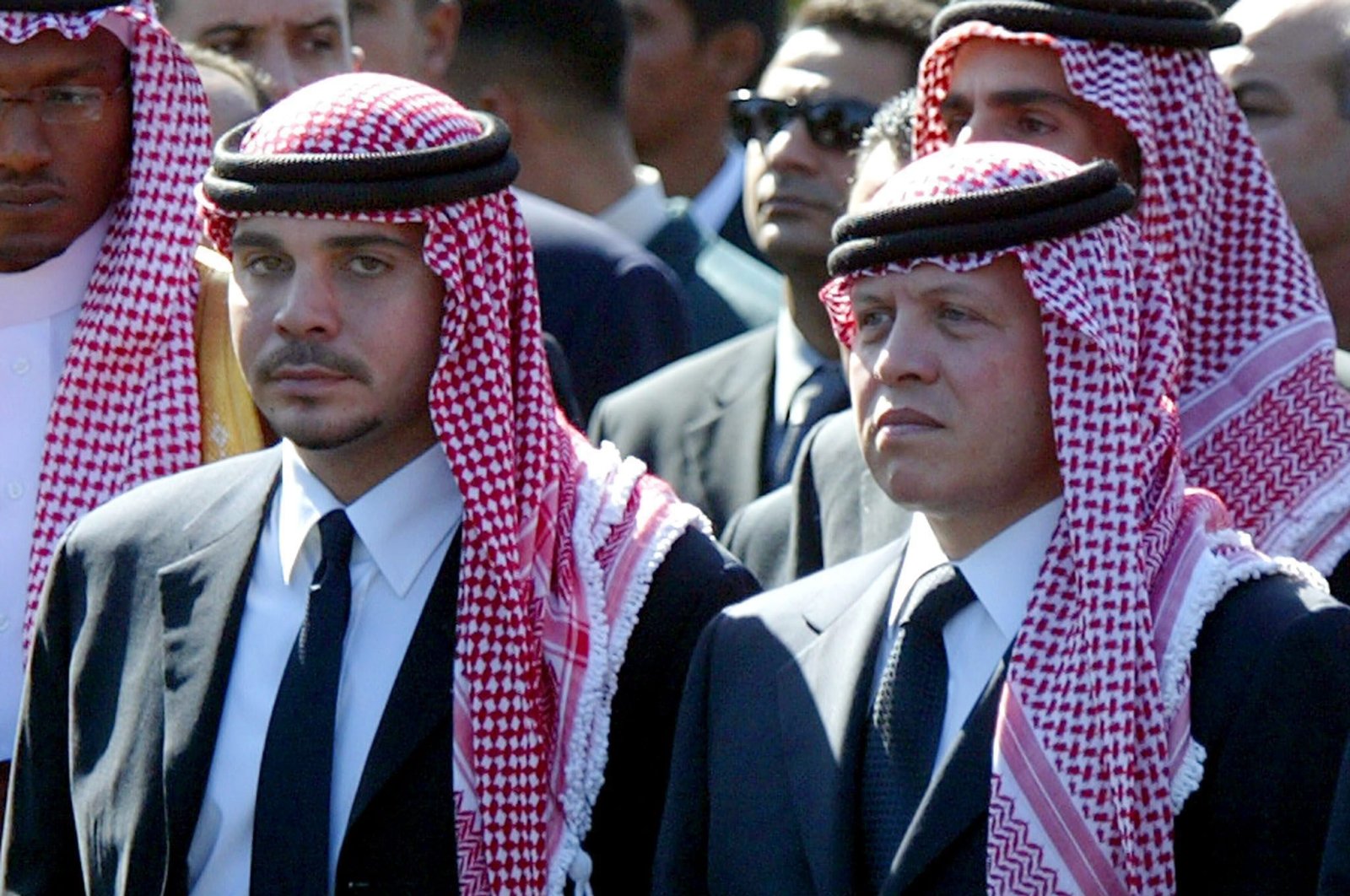 Former Jordanian Crown Prince Hamzah bin Al Hussein (L) with his half-brother King Abdullah II of Jordan (R) as they walk together in the funeral procession of Palestinian President Yasser Arafat in Cairo, Egypt, 12 Nov. 12, 2004.  (EPA-EFE/MIKE NELSON)