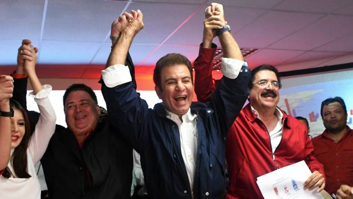 Presidential candidate for the Honduran Opposition Alliance against the Dictatorship, Salvador Nasralla (C) celebrates with Iroshka Elvir de Nasralla (L), Guillermo Valle (2-L) and former president Manuel Zelaya (2-R) after the general election, in Tegucigalpa on November 27, 2017. Initial election results released early Monday in Honduras showed opposition candidate Salvador Nasralla leading President Juan Orlando Hernandez, after a tense evening that saw both men declare themselves the winner before official numbers were announced. / AFP PHOTO / Orlando SIERRAORLANDO SIERRA/AFP/Getty Images