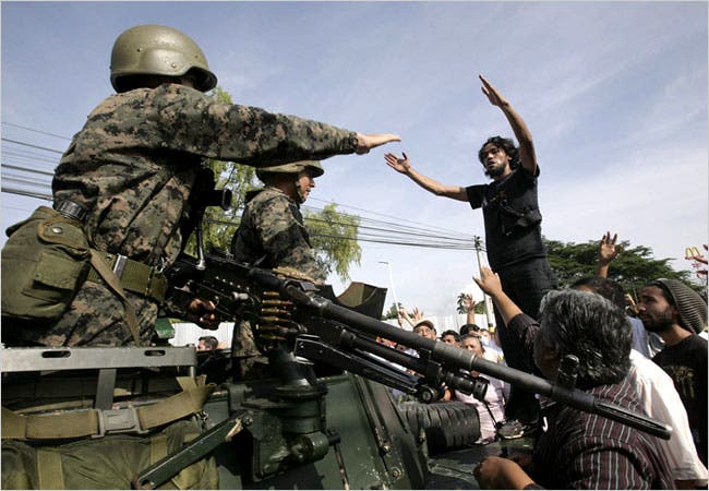 Supporters of President Manuel Zelaya blocked a street to prevent tanks from arriving near the presidential palace in Tegucigalpa.