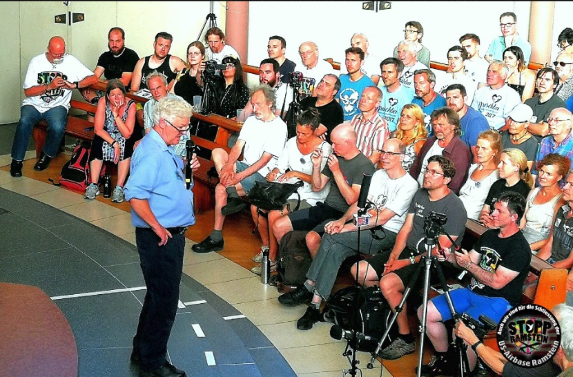 Telling people in a church in Kaiserslautern, Germany their water is poisoned.