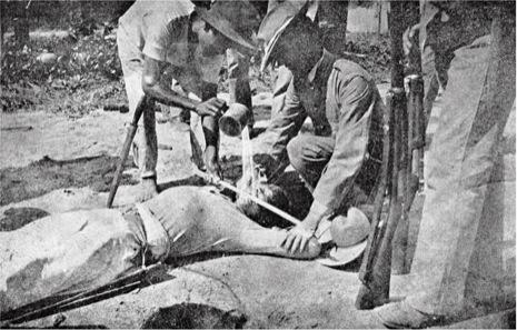 U.S. troops administering the "water cure"