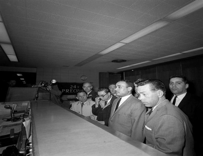 A group of men in a room

Description automatically generated with low confidence