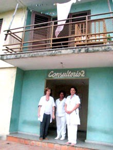 A group of men standing in front of a building

Description automatically generated with low confidence