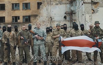 A group of soldiers holding a flag

Description automatically generated with low confidence