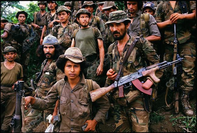 A picture containing person, military uniform, weapon, group
Description automatically generated