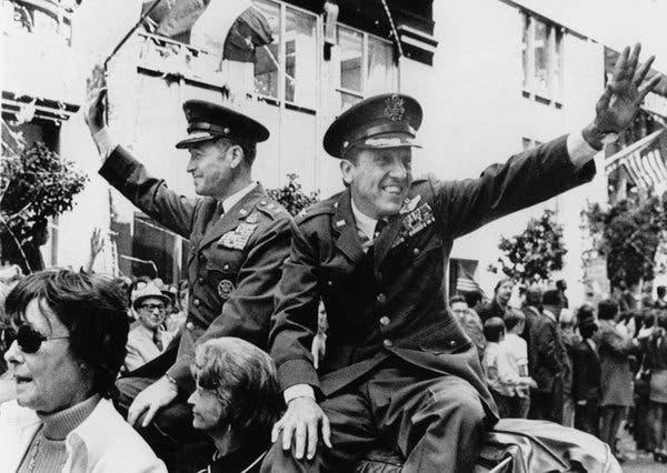 After his release in 1973, Colonel Risner, right, and Maj. Gen. LeRoy J. Manor rode in a parade in San Francisco.