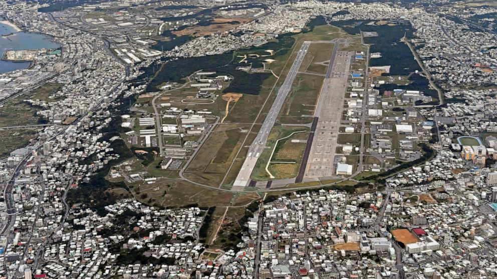 FILE - This Jan. 27, 2018, aerial file photo shows U.S. Marine Air Station Futenma in Ginowan, Okinawa, southern Japan. Okinawan officials said Saturday, July 11, 2020 that dozens of U.S. Marines have been confirmed to have infected with the coronavi
