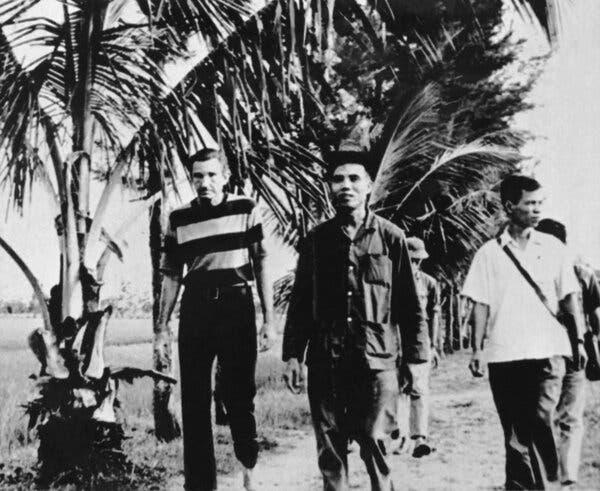 Mr. Clark, left, in North Vietnam in 1972. He met with Communist officials in Hanoi and publicly criticized American conduct of the Vietnam War.