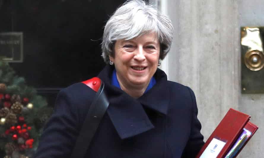 Theresa May leaves Downing Street in London
