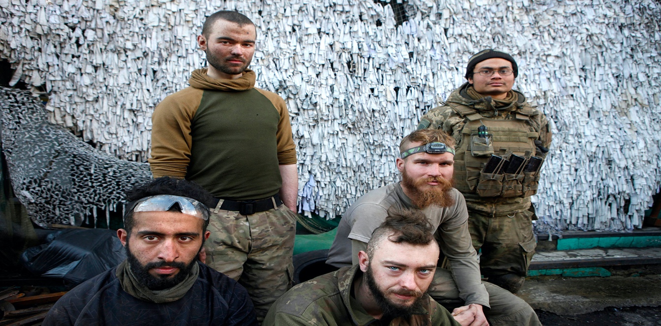 A group of men posing for a photo

Description automatically generated with medium confidence