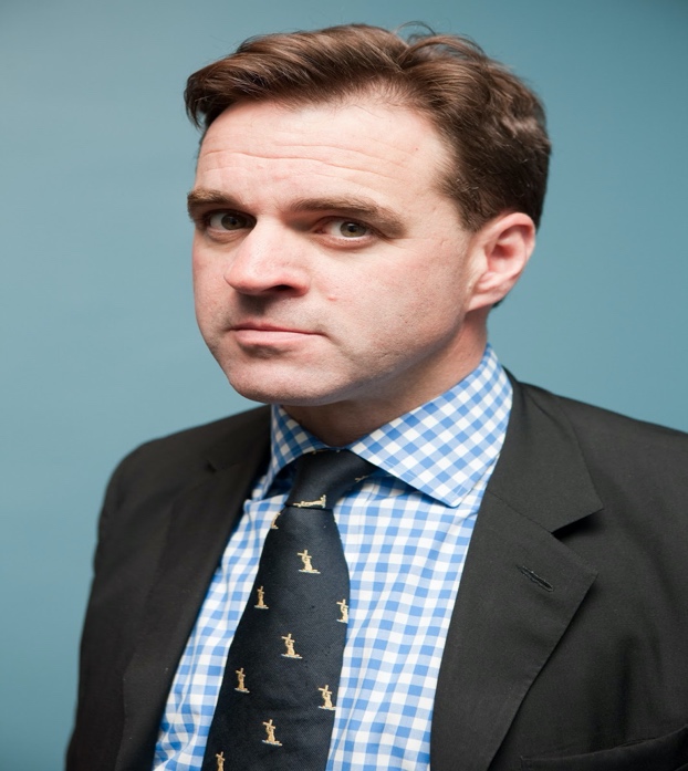 A person in a suit
Description automatically generated with medium confidence