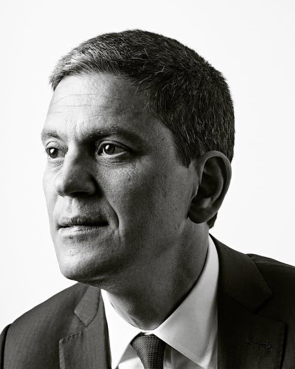 A person in a suit

Description automatically generated with medium confidence