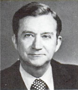 A person in a suit

Description automatically generated with low confidence