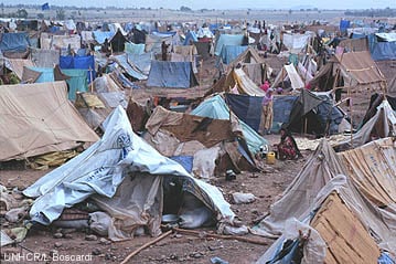 A picture containing outdoor, people, tent, crowd

Description automatically generated