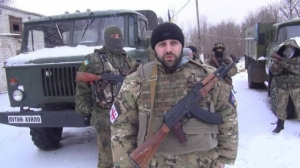 A picture containing person, snow, outdoor, military vehicle

Description automatically generated