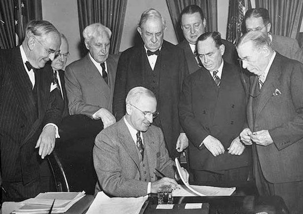 Truman Signing the Marshall Plan