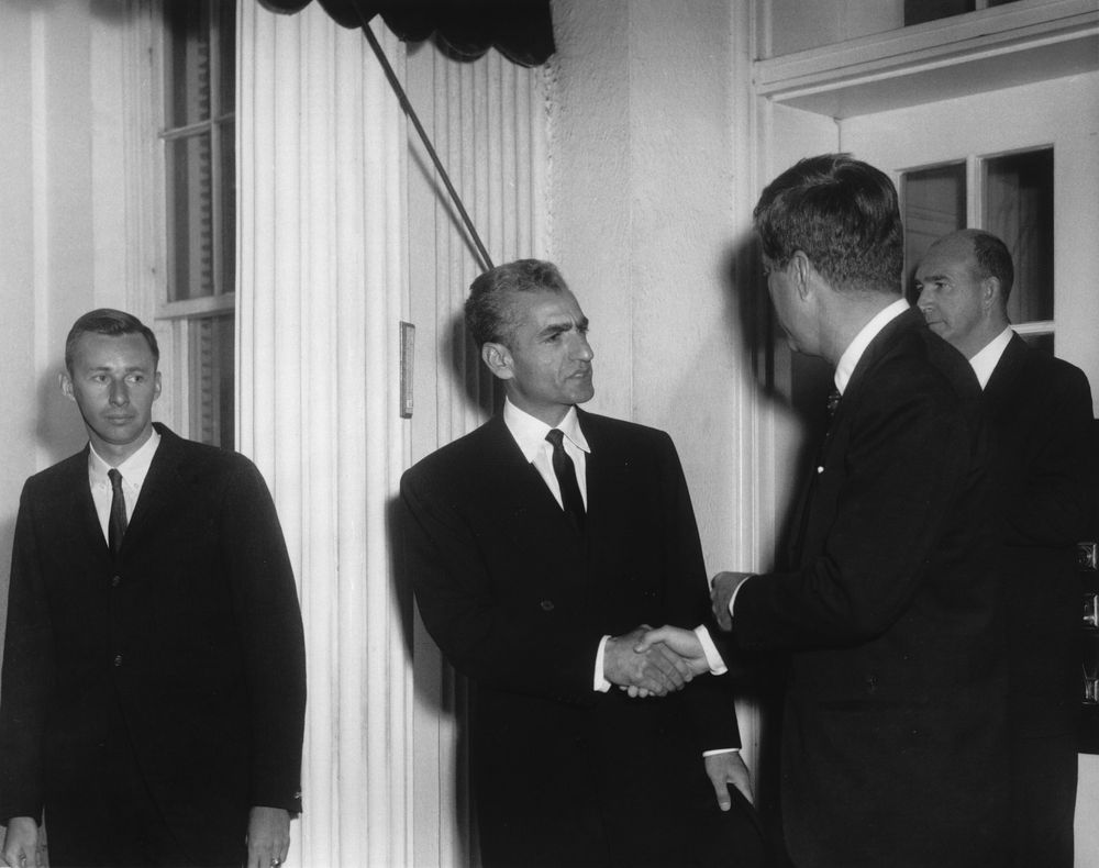 A group of men in suits

Description automatically generated with low confidence