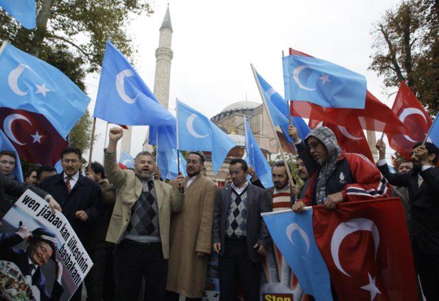 A group of people holding flags

Description automatically generated with medium confidence