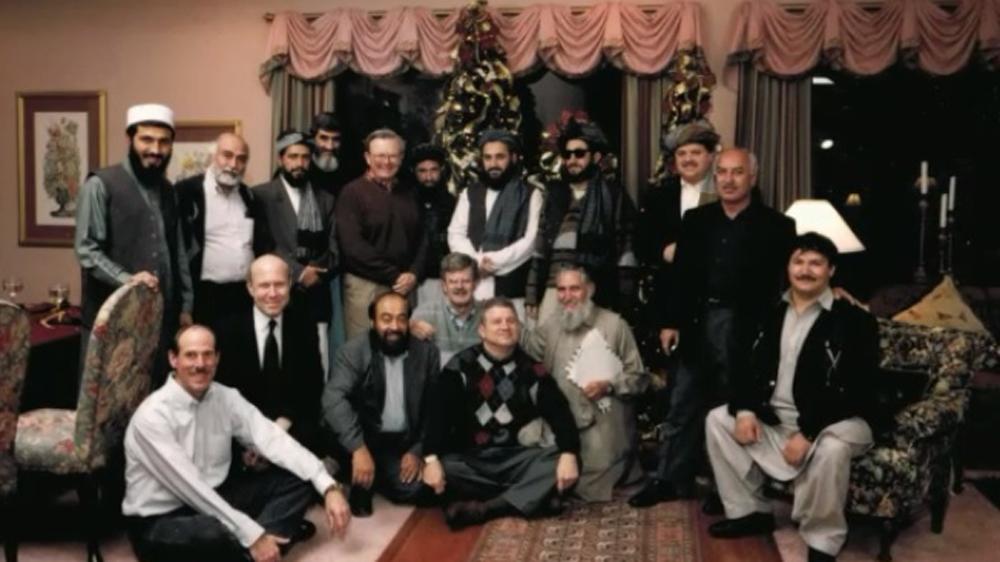 A group of people posing for a photo

Description automatically generated