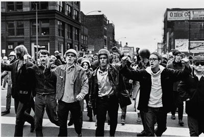 A group of people walking on a street

Description automatically generated with medium confidence