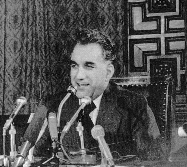A person sitting in front of microphones

Description automatically generated with low confidence