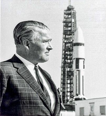 A person standing in front of a tall tower

Description automatically generated with low confidence