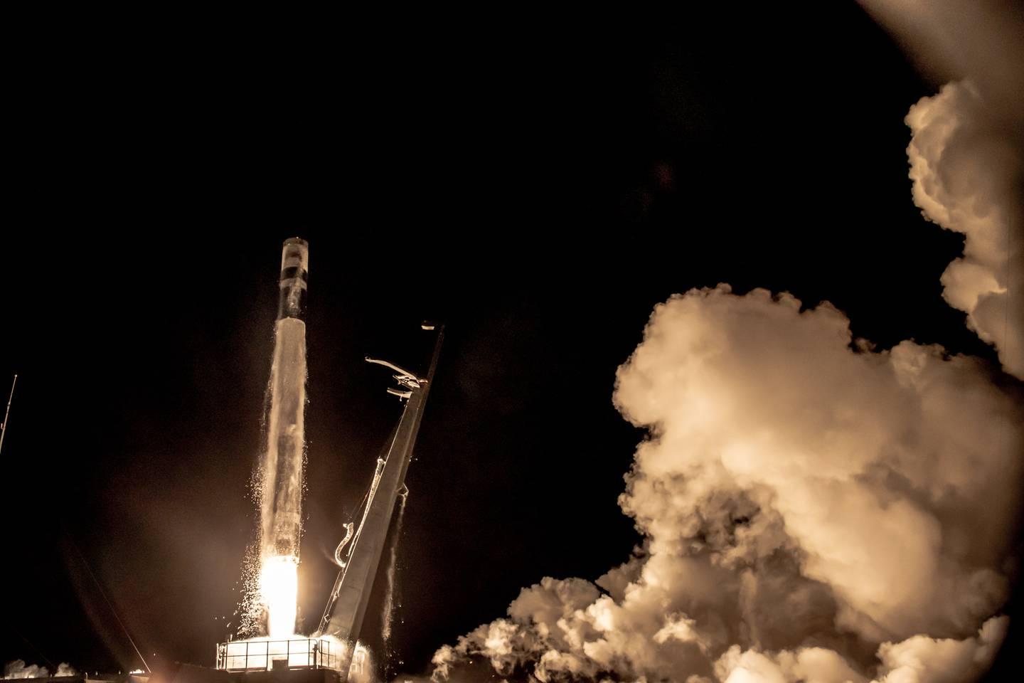 A picture containing smoke, transport, dark, rocket

Description automatically generated