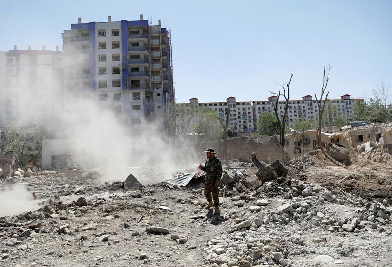 An Afghan National Army (ANA) soldier stands at the site of Monday's blast in Kabul, Afghanistan July 2, 2019. Taliban Islamist fighters killed six people and wounded 105 others by blowing up a truck bomb at morning rush hour near an Afghan Defence Ministry compound in Kabul. REUTERS/Mohammad Ismail