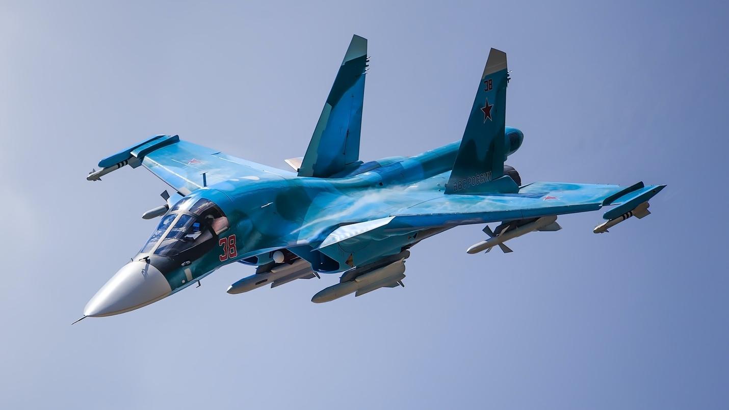 A blue airplane flying in the sky

Description automatically generated with medium confidence