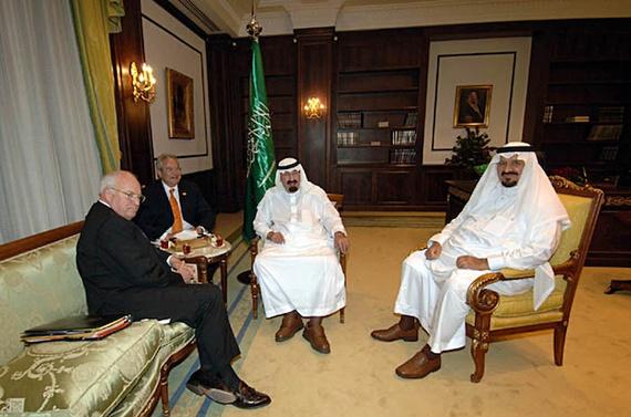 A group of men sitting around a table

Description automatically generated with medium confidence