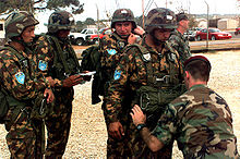 A group of people in military uniforms

Description automatically generated with low confidence