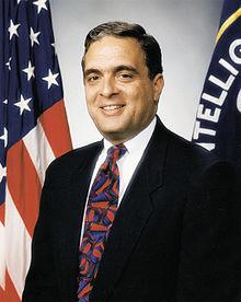 A person in a suit and tie

Description automatically generated with low confidence