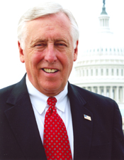A person in a suit and tie
Description automatically generated with medium confidence