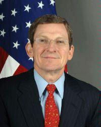 A person in a suit and tie

Description automatically generated with low confidence